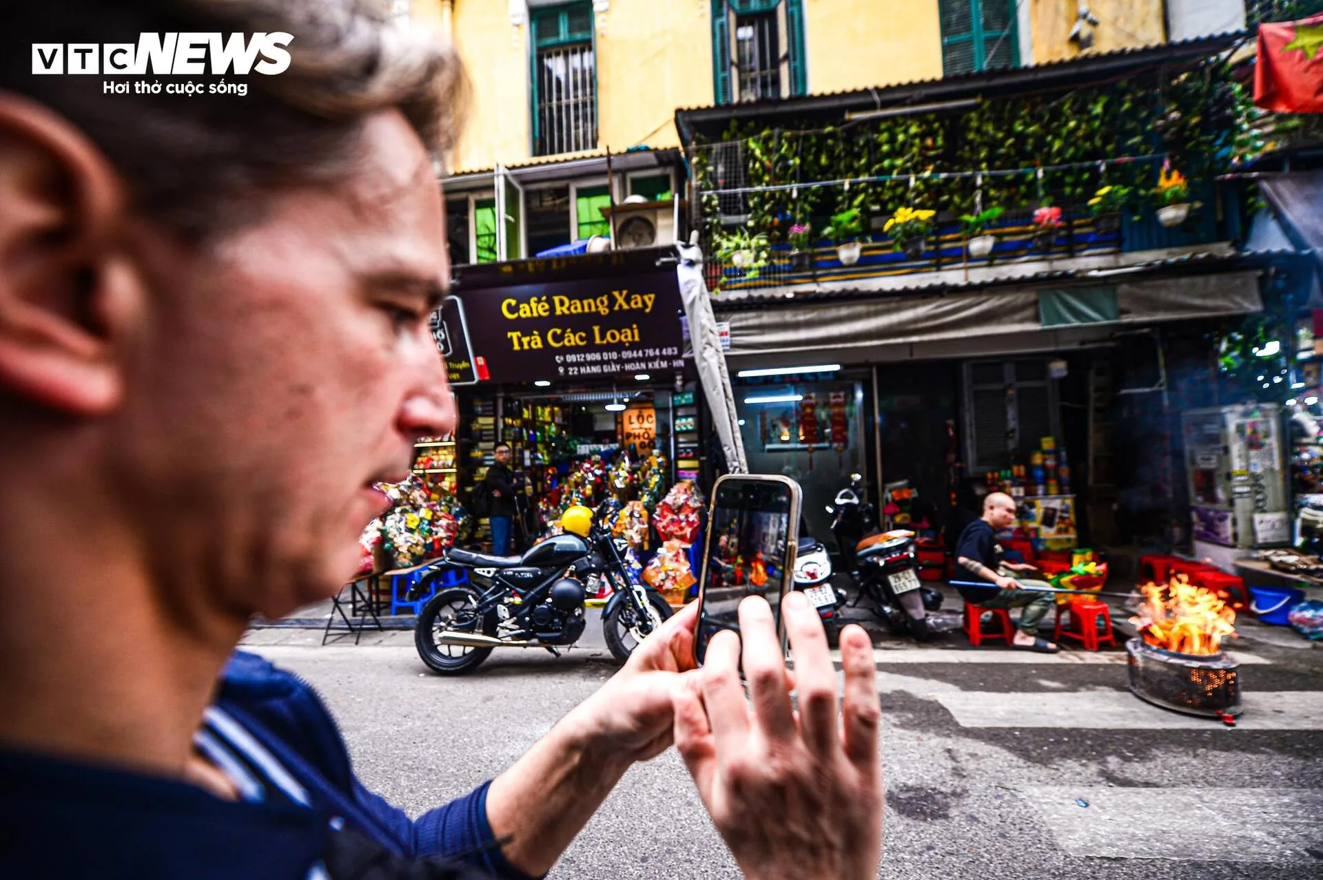 foreigners watching joss paper ritual